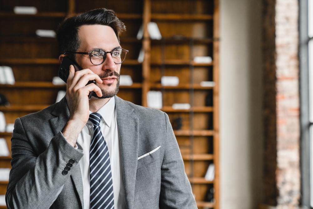 Lawyer solicitor having online conversation with customers clients remotely at workplace